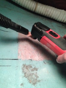 Stripping paint and roughing up the glass.  Using a vacuum to minimize dust in the boat.